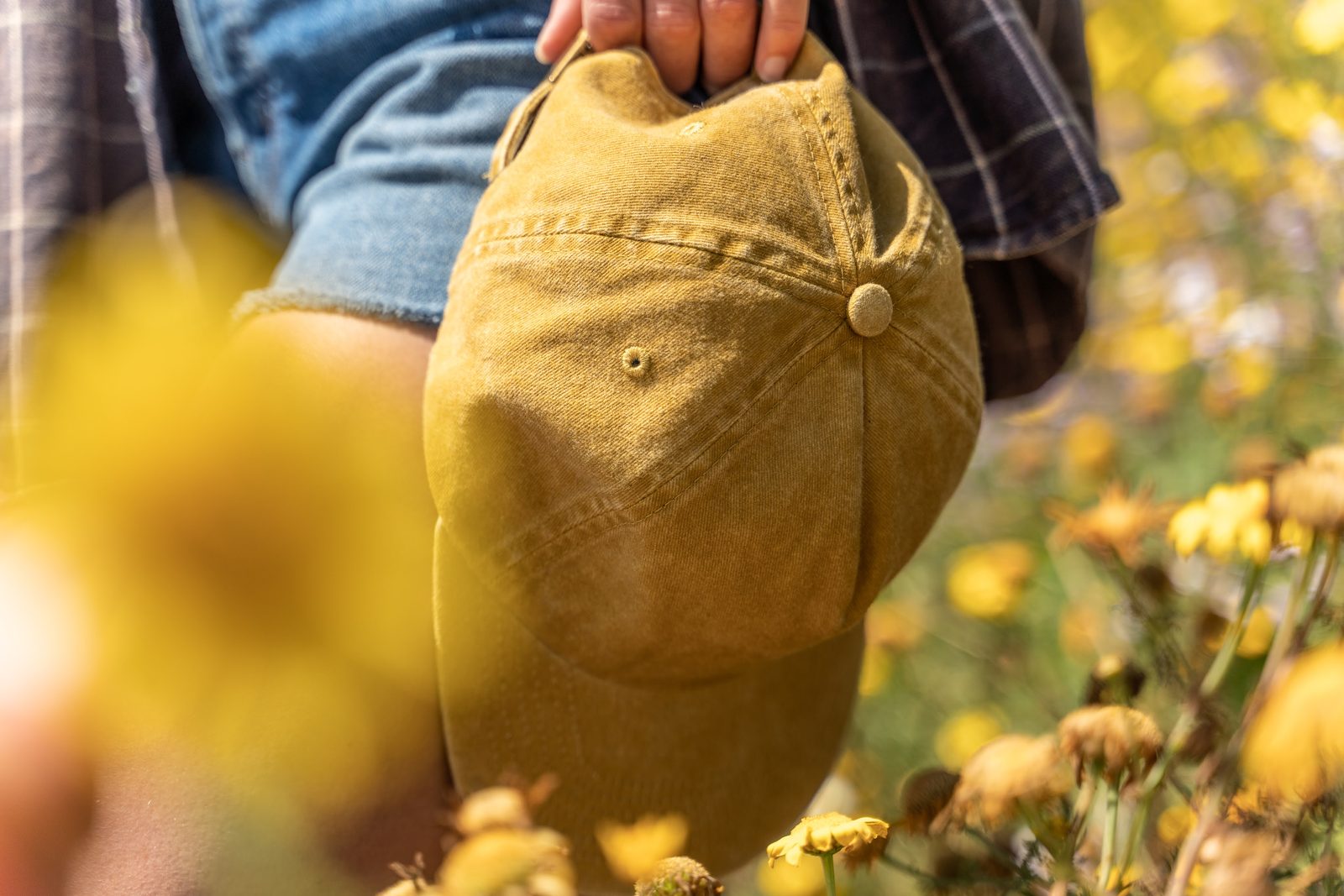 Detail shot of mustard colored Rora Basics cap construction